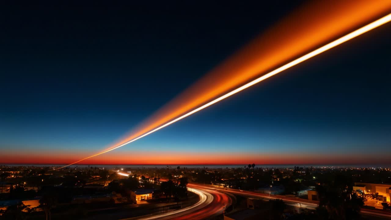 A breathtaking transition from day to night captures the stunning colors of the sky, with vibrant hues blending seamlessly into the horizon of a bustling city landscape underneath a striking contrail