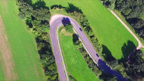 a birdseye shot of heavy curved road - nationalpark eifel