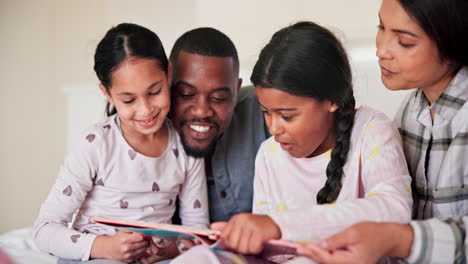 Parents,-kids-and-reading-books-in-bedroom