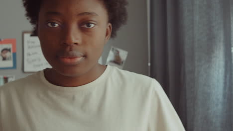 portrait of young african american woman at home