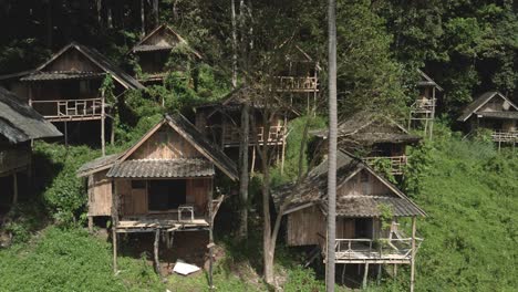 aerial back dolly run down empty thai bungalows with no tourists