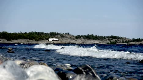 waves crashing on sweden's most famous shoreline for windsurfing in stockholms south archipelago