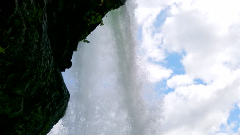 unusual steinsdalsfossen waterfall steine, norway tilt down from behind falls 4k prorezhq