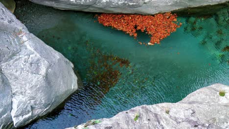 Clear-water-with-slow-flow-is-hugged-by-the-rocks