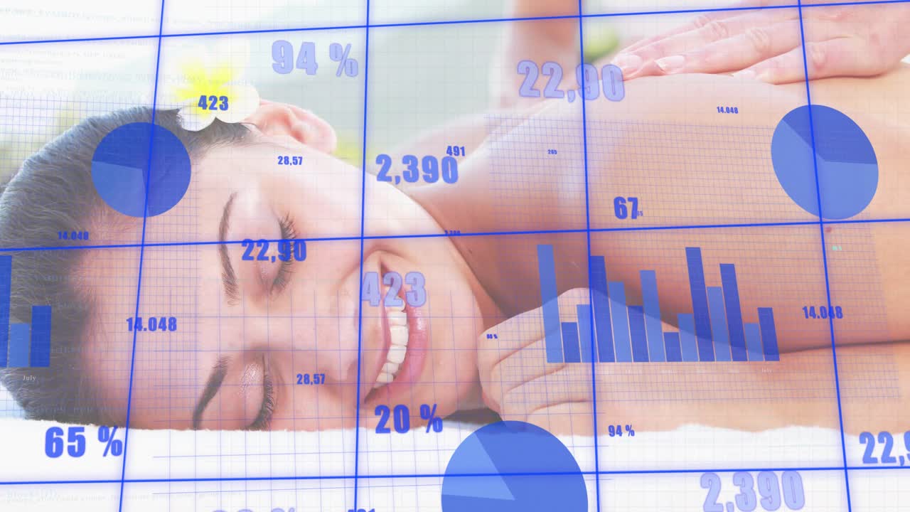 Therapist spreading oil and kneading shoulders triggers blue charts tracking spa relaxation