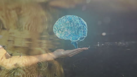 glowing holographic brain floating above palm-up hand in digital render showing circuitry patterns