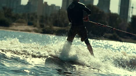 extreme sportsman riding water. wake boarding sport. summer adrenaline