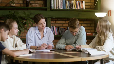 Teacher-and-students-in-religion-class,-studying-the-Bible