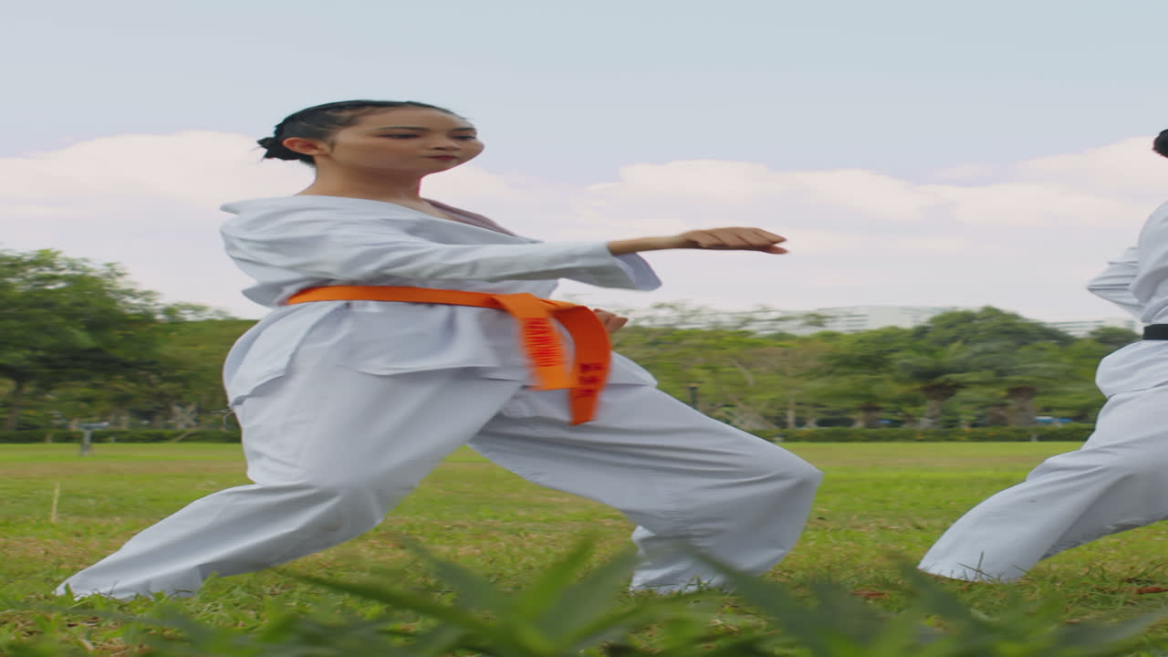 Gen Z Female Athlete Practicing Punches in Park