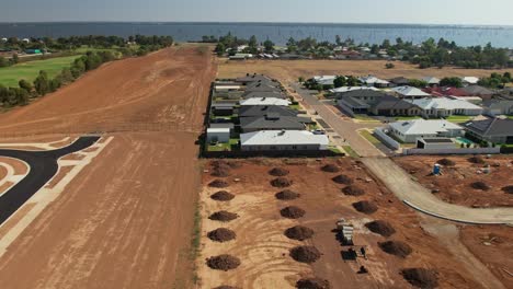 yarrawonga, victoria, australia - 3 march 2023: revealing new residential area and road with lake mulwala in the background