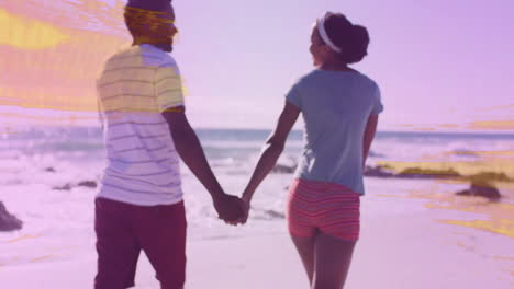 couple walking hand in hand on beach, displaying floating heart icon and pulse graph for health
