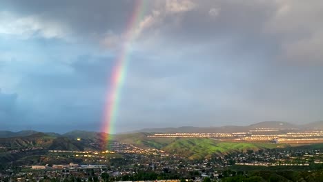 Rainbow-over-Santa-Clarita,-California---stunning-aerial-view