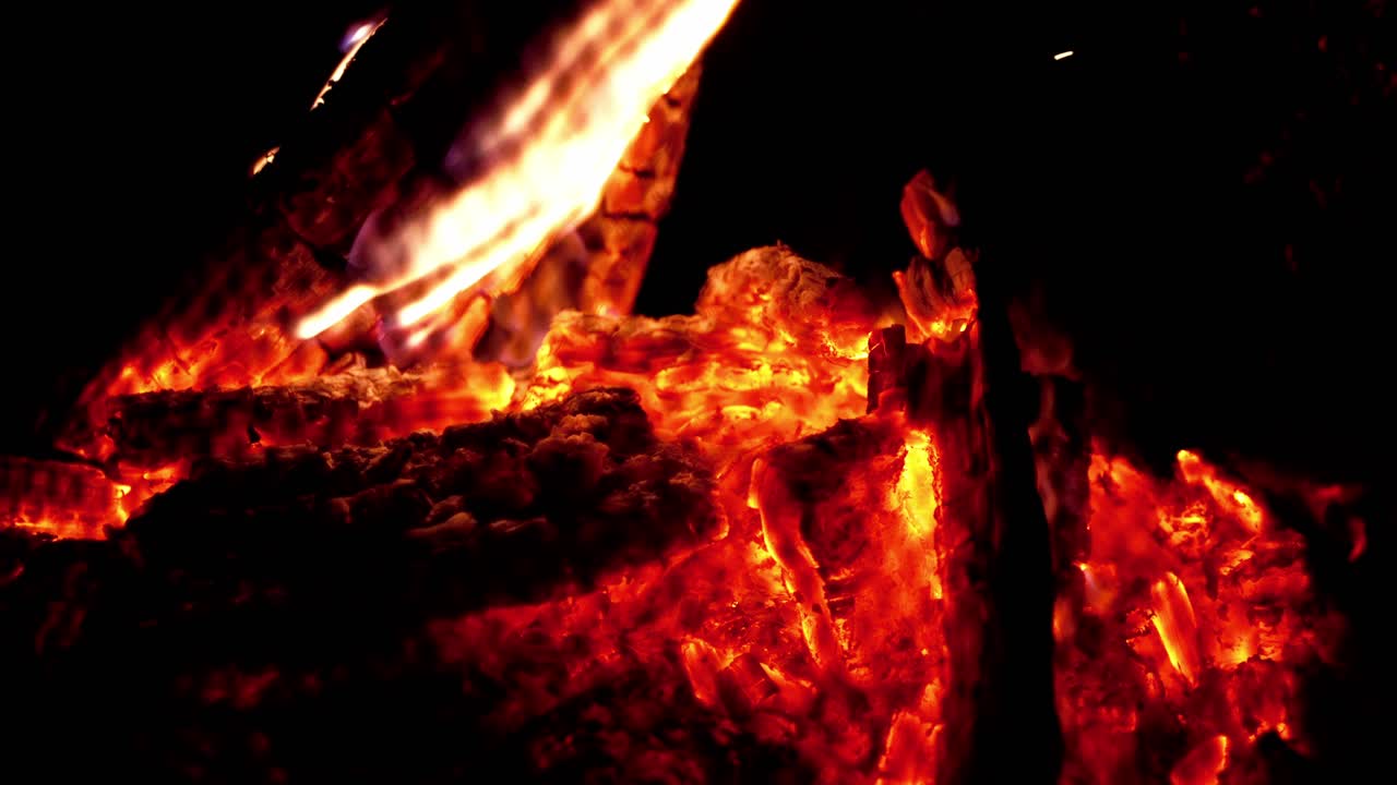 Bonfire flames, drywood embers, glowing kindling, illuminated darkness