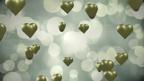 animation of gold hearts over light spots on grey background