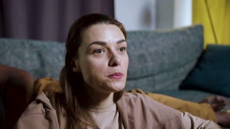 woman watching film at home