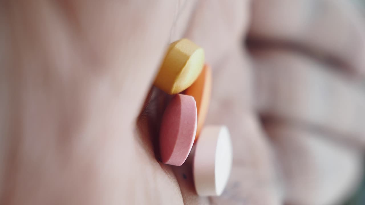 Hand Holding Assorted Pills