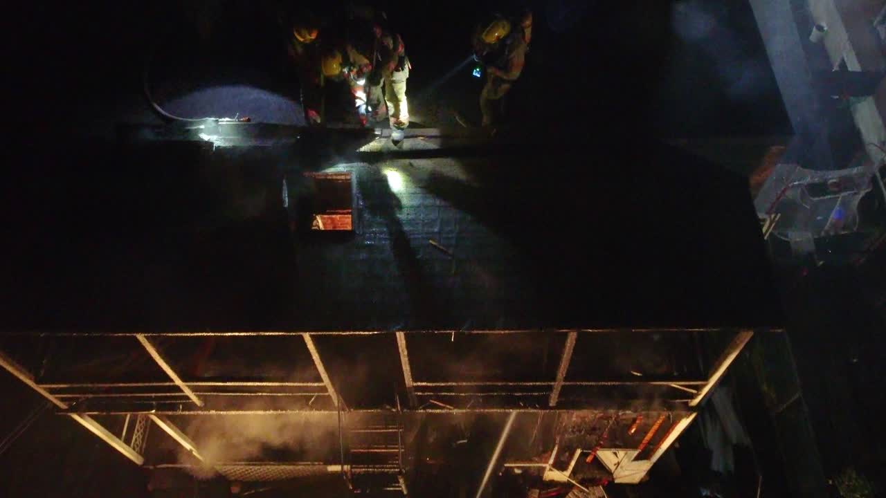 Firefighters Battling a Building Fire at Night