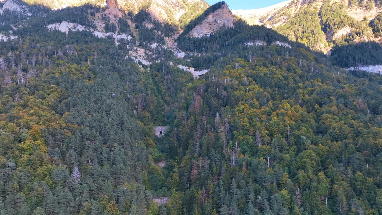 Aerial reverses from steep Canfranc hillside and famed ravine of the bell towers