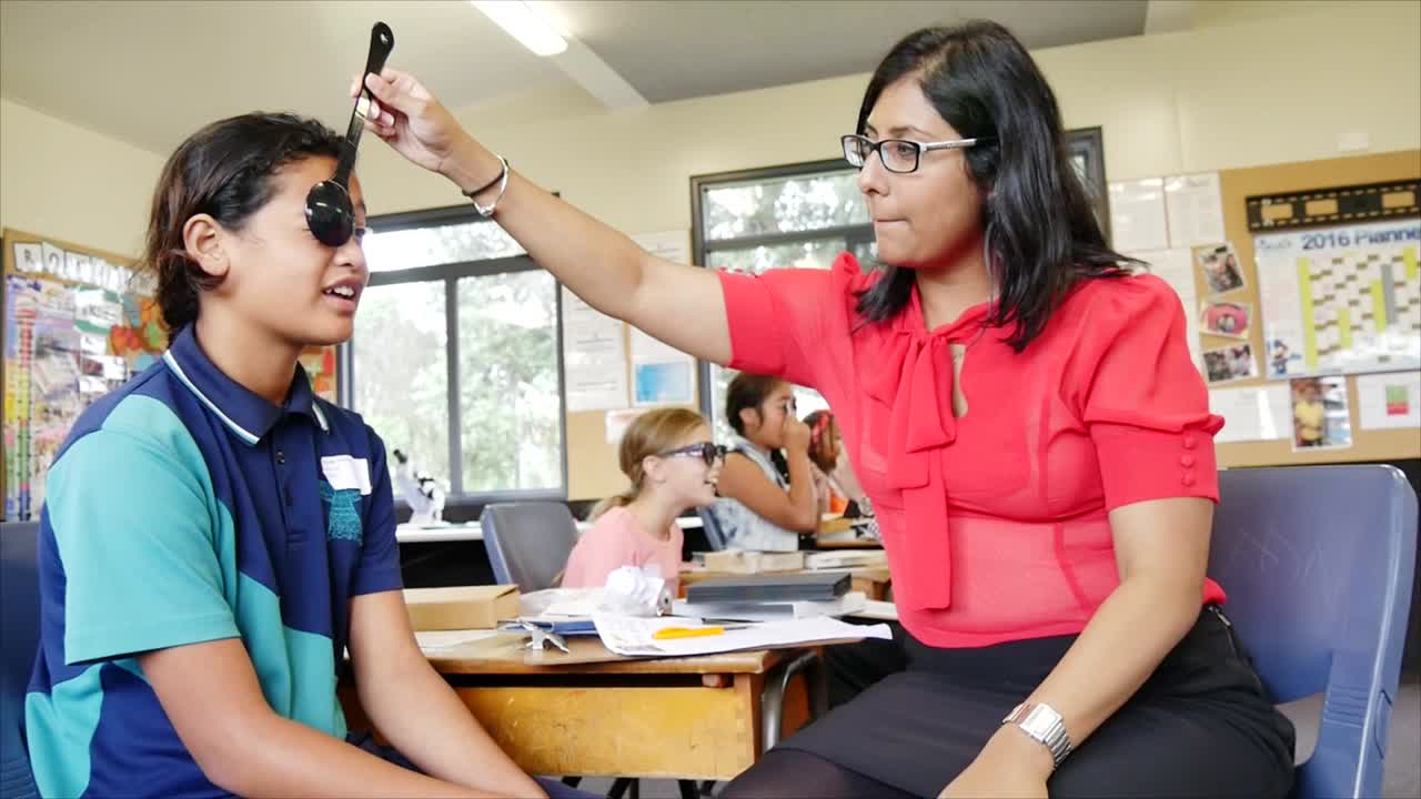 Auckland New Zealand  Opticians checking the eye sight of school children in primary school