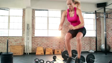 Fit-woman-doing-box-jumps