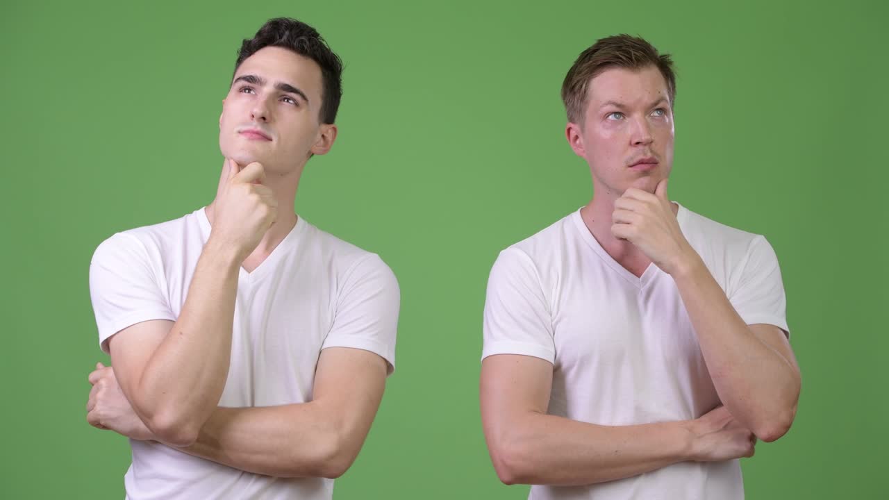 Two young handsome men thinking together