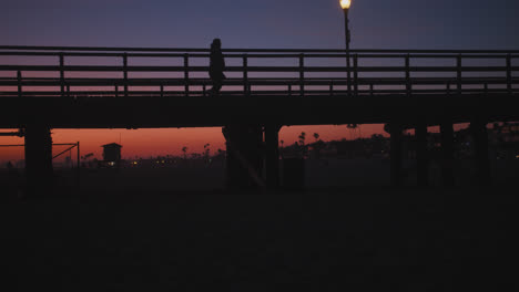 deep orange sunset at the seal beach pier