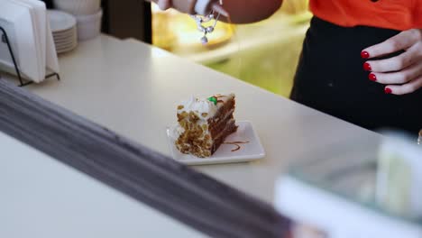 waitress serving a sweet cake