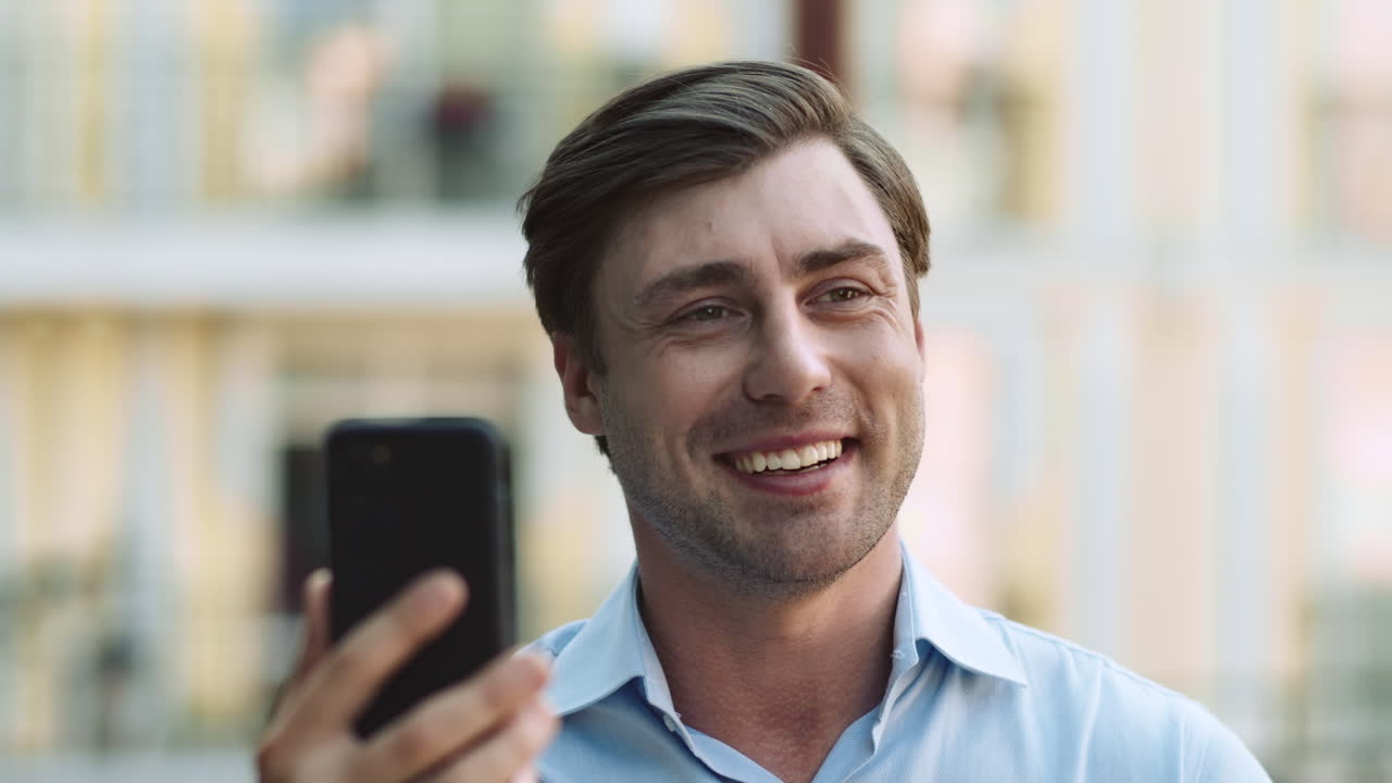 Portrait of man using phone for video chat
