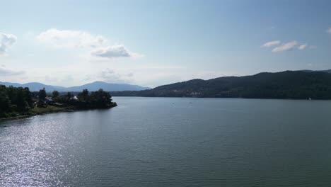 Majestic-Zywiec-lake-in-Beskid-mountains---aerial-view-4K