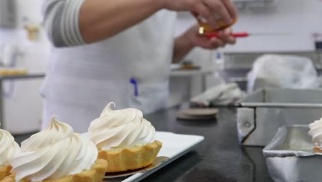 experience culinary artistry: close-up shot captures a chef skillfully crafting delicious sweets with expertise