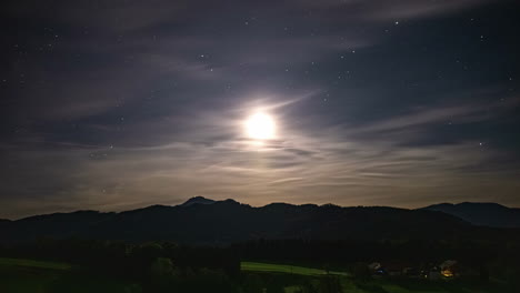 luminous moon and stars grace the austrian alps in a mesmerizing timelapse