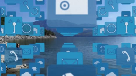 animation of digital icons floating over landscape