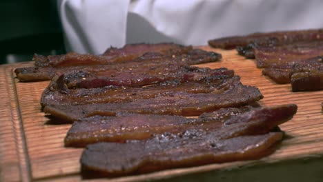 Beef-strips-placed-under-heater-at-Brazilian-restaurant