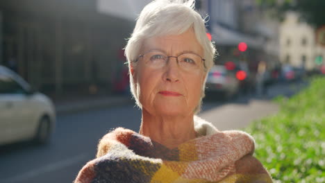 a stylish senior woman staring into the distance