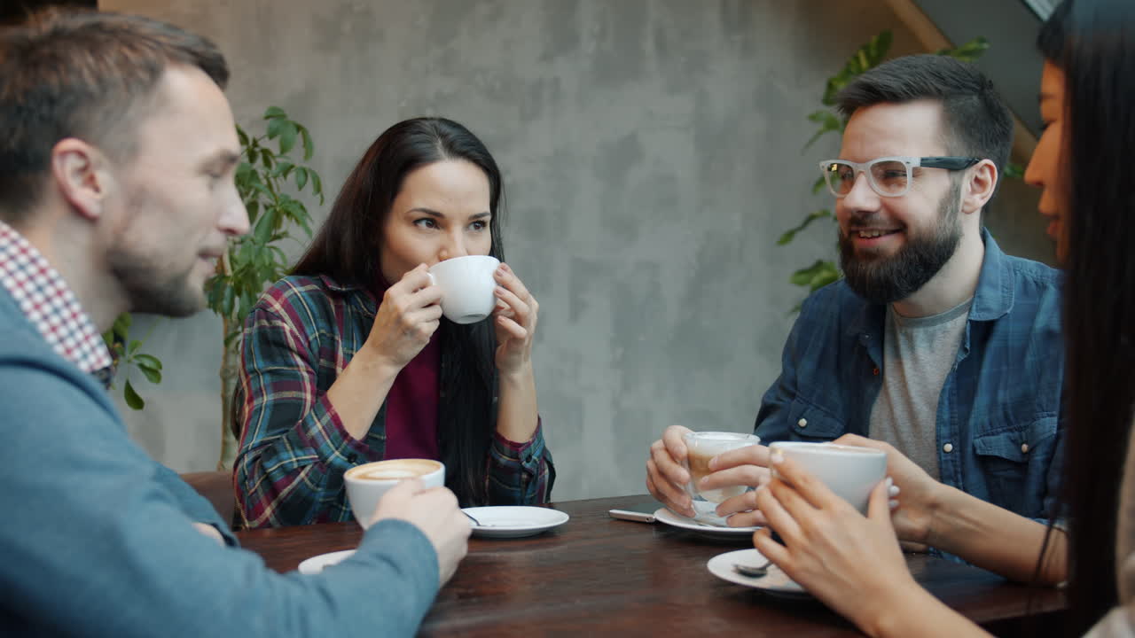 Friends Enjoying Coffee in a Cafe