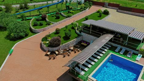 swimming pool in recreation center. modern territory for leisure activity in the countryside. stylish recreation area on outdoor weekends in summer. aerial view.