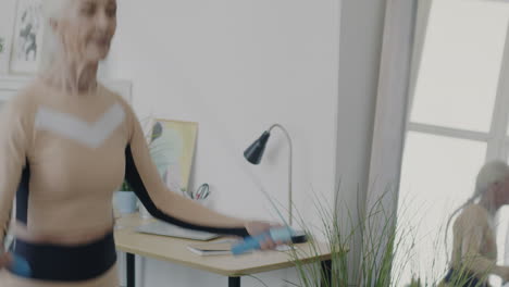 senior woman jumping rope at home