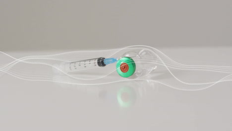 animation of lines over vial and syringe on white background