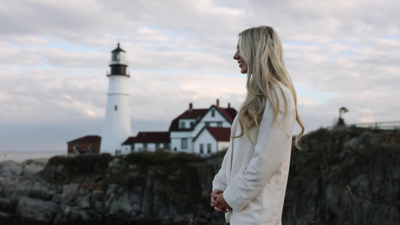 Beautiful Blonde Model Smiling, Lighthouse In Background