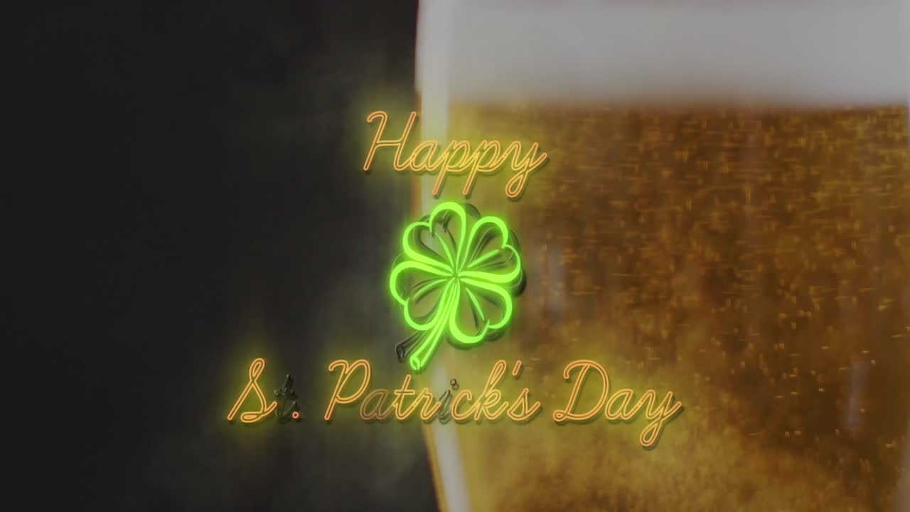 Animation of happy st patrick's day with clover icon over glass of beer