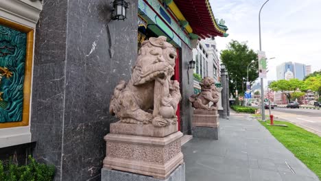 a walk past ornate temple guardians and walls.