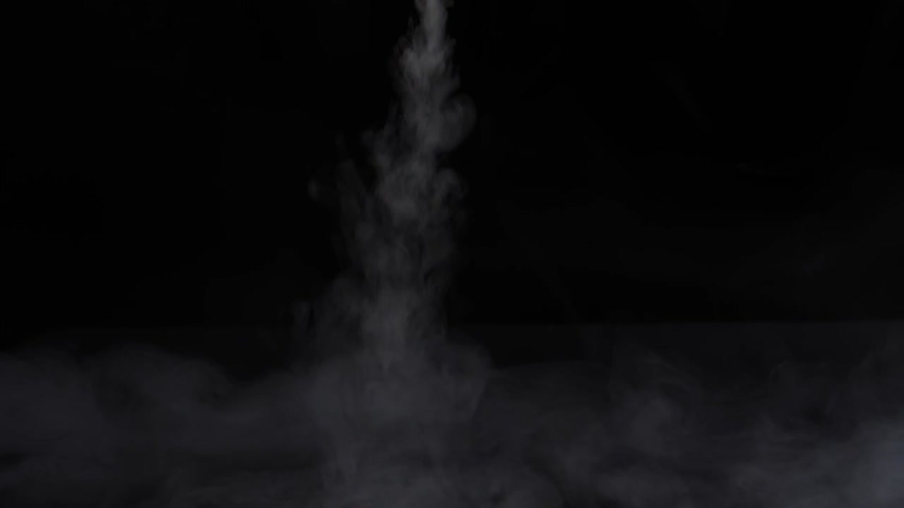 Real White Smoke  Spraying From The Top To Down On Black Background , Slow Motion