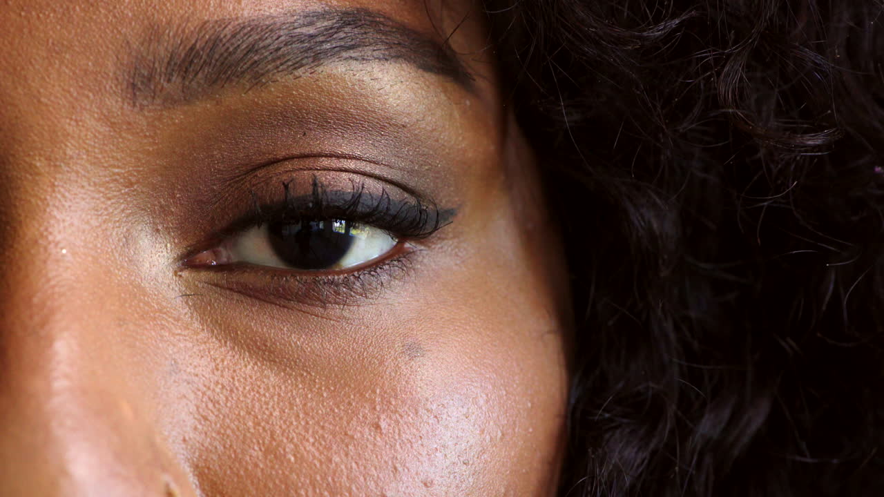 Portrait of a woman with an intense stare blinking
