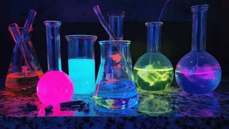 colorful glowing beakers in a lab