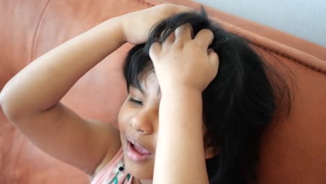 adorable girl playing with her hair