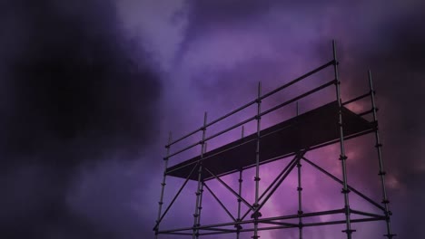 scaffold poles against thunderstorm and dark clouds in the sky