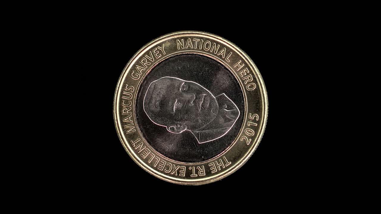 Jamaica 2015 20 dollars coin reverse with Marcus Garvey portrait rotating on black background