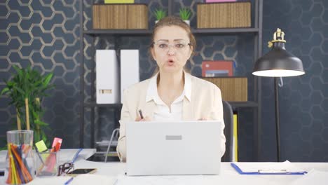 angry talking business woman looking at camera.