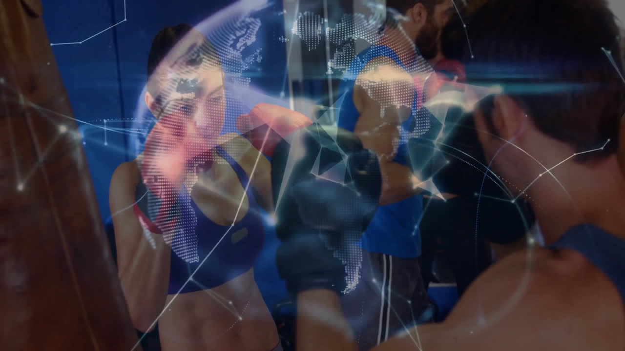 Female boxer throwing punch at focus pads in fitness training gym, featuring digital globe overlay