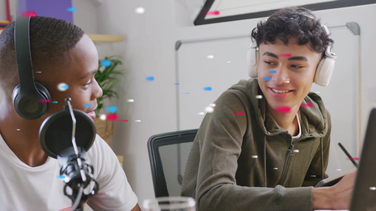 Vertical video: Seeing right smile left teen speaking to mic in study while other drawing for class